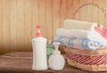 Shower gel with Skin cream and bath towels in basket Royalty Free Stock Photo