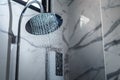 [shower head] shower head in bathroom with water drops flowing Royalty Free Stock Photo