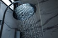 [shower head] shower head in bathroom with water drops flowing Royalty Free Stock Photo