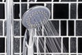 Shower head in bathroom with water drops flowing Royalty Free Stock Photo