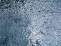 Shower head with flow of water spilling out closeup. Royalty Free Stock Photo