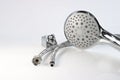 Shower head, wall mount and flexible water connections on a light background. Royalty Free Stock Photo