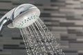 Shower head with water drops falling on a bathroom Royalty Free Stock Photo