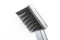 Shower head with water drops on a white background Royalty Free Stock Photo