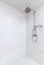 A shower with marble subway and hexagon tiles. Royalty Free Stock Photo