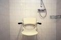 Shower seat wall mounted for disabled person or elderly, shower for handicapped or senior home Royalty Free Stock Photo