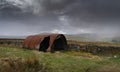 A snow storm approaches an old tin shed near Garrigill,, Cumbria