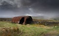 A snow storm approaches an old tin shed near Garrigill,, Cumbria