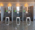 Shower space of a traditional Japanese indoor onsen hot spring with bath chairs and buckets. Royalty Free Stock Photo
