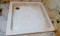 Shower tray made of ceramic material for an hotel bathroom with necessary sanitary and plumbing fittings