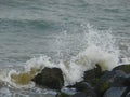 Shower of Water Droplets due to Sea Waves Crashing on Rocks Royalty Free Stock Photo