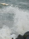 Shower of Water Droplets due to Sea Waves Crashing on Rocks Royalty Free Stock Photo