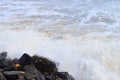 Shower of Water Drops with Splashing of Sea Wave after Hitting Rocks on Shore - Ocean Natural Aqua Background Royalty Free Stock Photo