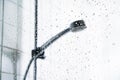 Shower and water on glass screen. Cabin stall window with drops in focus. Faucet head in bathroom. Hot, cold or warm. Royalty Free Stock Photo