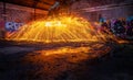 Showers of hot glowing sparks from spinning steel wool Royalty Free Stock Photo