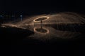 Showers of hot glowing sparks from spinning steel wool. Royalty Free Stock Photo