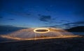 Showers of hot glowing sparks from spinning steel wool. Royalty Free Stock Photo