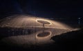 Showers of hot glowing sparks from spinning steel wool. Royalty Free Stock Photo