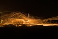 Showers of hot glowing sparks from spinning steel wool. Royalty Free Stock Photo