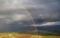 Showers and rainbow over the Sea of Galilee, Israel`s natural water sources, on a winter day with dramatic rain clouds scenery Royalty Free Stock Photo