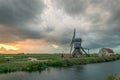 Classic dutch windmill under a stormy sky in the wide open countryside near Leiden, Holland Royalty Free Stock Photo