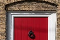 Abstract view of a newly installed wooden door installed to an old terraced house. Royalty Free Stock Photo