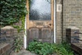 Abstract view of a newly installed wooden door installed to an old terraced house. Royalty Free Stock Photo
