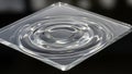Clear Square Acrylic Plate with Concentric Ripples and Soft Lighting Against a Dark Background Royalty Free Stock Photo
