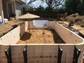 In ground residential swimming pool construction. Prefab walls.