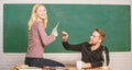 Showing a dedication to education. Man and woman back to school. High school education. Pretty teacher and handsome Royalty Free Stock Photo