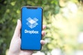 Turkey, Istanbul - September 15.2018: Hands on experience on Dropbox. Reviewing Dropbox application. Showing Dropbox on mobile pho