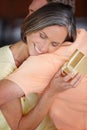 Showing her appreciation. an attractive mature woman hugging her husband after receiving a gift from him. Royalty Free Stock Photo