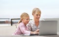 Showing her how its done. a young girl and her mother using a laptop together. Royalty Free Stock Photo
