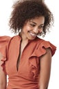 Showing off a demure style. Cute young african american woman looking away shyly and smiling. Royalty Free Stock Photo