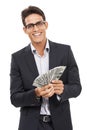 Showing off his success. Portrait of a young businessman holding cash. Royalty Free Stock Photo