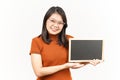 Showing, Presenting and holding Blank Blackboard Of Beautiful Asian Woman Isolated On White Background Royalty Free Stock Photo