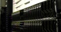Showing server rack featuring hot-swappable drive bays in data center, with HTML code overlay Royalty Free Stock Photo
