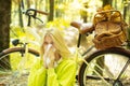 Showing sick woman sneezing at park. Sick girl with cold and flu standing outdoors.