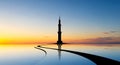 Silhouette of a minaret and mosque on a reflective surface at sunset with colorful sky (114 Royalty Free Stock Photo