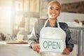 Showing, smile and portrait of a business owner with an open sign at a cafe in the morning. Restaurant, happy and woman Royalty Free Stock Photo