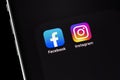 Showing social media apps Facebook, Instagram - on screen smartphone iPhone