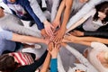 Showing their business unity. High angle shot of a group of businesspeople with their hands in a huddle.