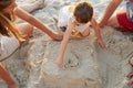 Showing them some love. Shot of a family building sandcastles together at the beach. Royalty Free Stock Photo