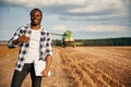 Showing thumb up. Beautiful African American man is in the agricultural field Royalty Free Stock Photo