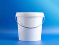 White plastic bucket with white lid and wire handle on blue background Keywords: bucket, container, plastic, white Royalty Free Stock Photo