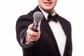 The Showman interviewer. Young elegant man holding microphone Royalty Free Stock Photo