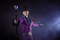 Showman. Young male entertainer, presenter or actor on stage. The guy in the purple camisole and the cylinder. Royalty Free Stock Photo