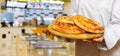 Shows bread cakes on a blurred background of a cafe
