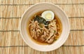 shoyu ramen or Japanese yellow noodles topping slice braised pork and boiled egg in spicy soy sauce soup on bowl Royalty Free Stock Photo