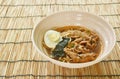 shoyu ramen or Japanese yellow noodles topping slice braised pork and boiled egg in spicy soy sauce soup on bowl Royalty Free Stock Photo